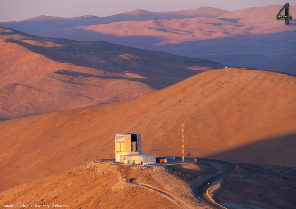 Vista telescope and surrounding mountains during sunset.